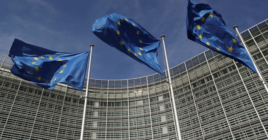 European Union flags flutter outside the European Commission headquarters in Brussels, Belgium, March 24, 2021. REUTERS/Yves Herman