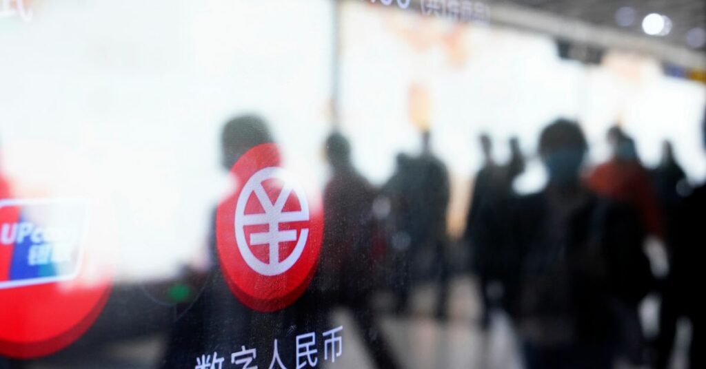 A sign indicating digital yuan, also referred to as e-CNY, is pictured on a vending machine at a subway station in Shanghai, China April 21, 2021. Picture taken April 21, 2021. REUTERS/Aly Song