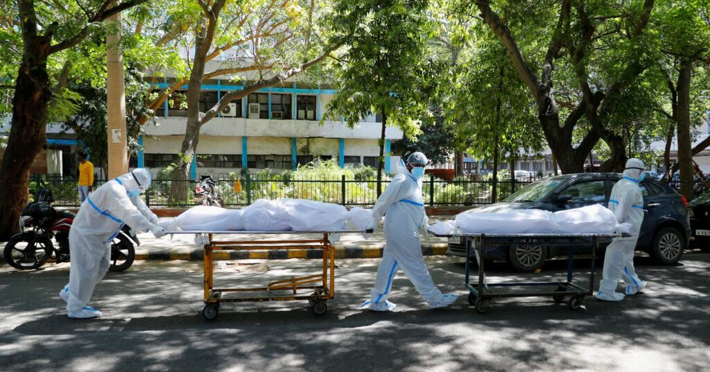 A patient suffering from the coronavirus disease (COVID-19) waits to get admitted outside the casualty ward at Guru Teg Bahadur hospital, amidst the spread of the disease in New Delhi, India, April 23, 2021. REUTERS/Danish Siddiqui