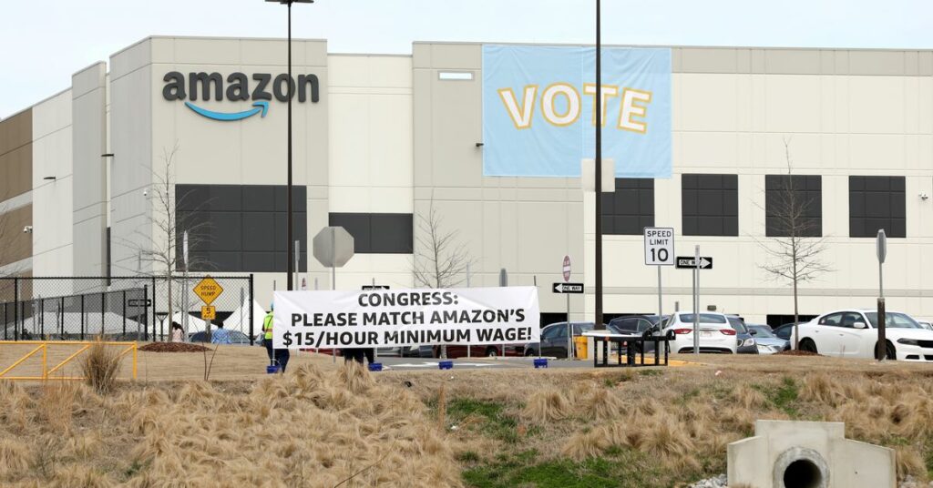 Banners are placed at the Amazon facility as members of a congressional delegation arrive to show their support for workers who will vote on whether to unionize, in Bessemer, Alabama, U.S. March 5, 2021.  REUTERS/Dustin Chambers