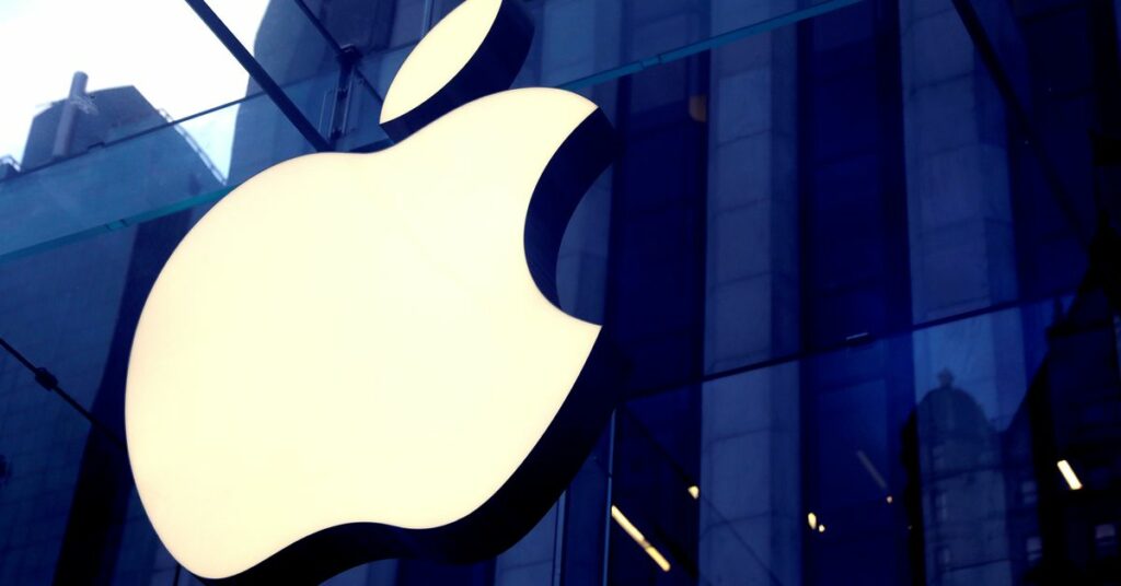 The Apple Inc logo is seen hanging at the entrance to the Apple store on 5th Avenue in Manhattan, New York, U.S., October 16, 2019. REUTERS/Mike Segar/File Photo