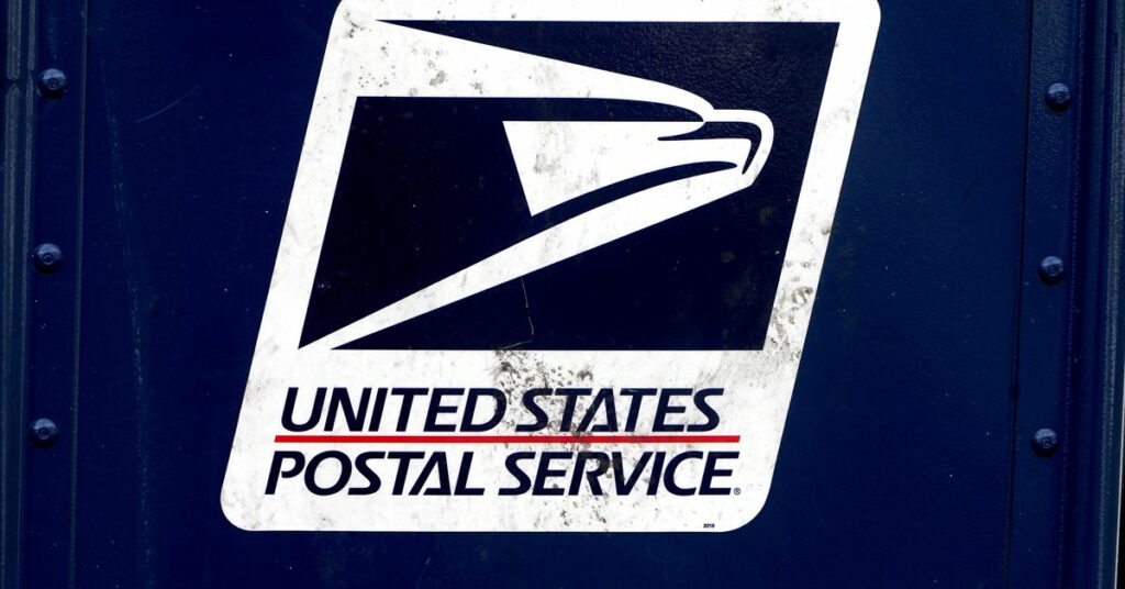 A U.S. Postal Service (USPS) logo is pictured on a mail box in the Manhattan borough of New York City, New York, U.S., August 21, 2020. REUTERS/Carlo Allegri