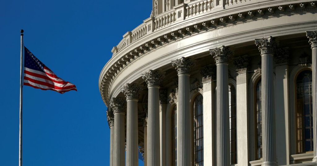 An American flag flies outside of the U.S. Capitol dome in Washington, U.S., January 15, 2020. REUTERS/Tom Brenner