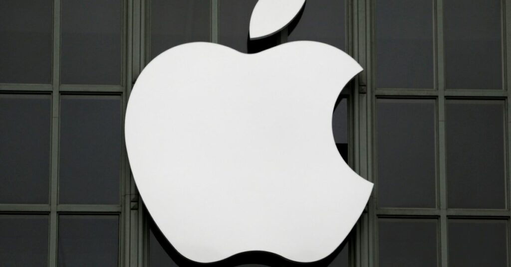 A woman is reflected in a Apple store logo in San Francisco, California, U.S., August 21, 2017. REUTERS/Kevin Coombs