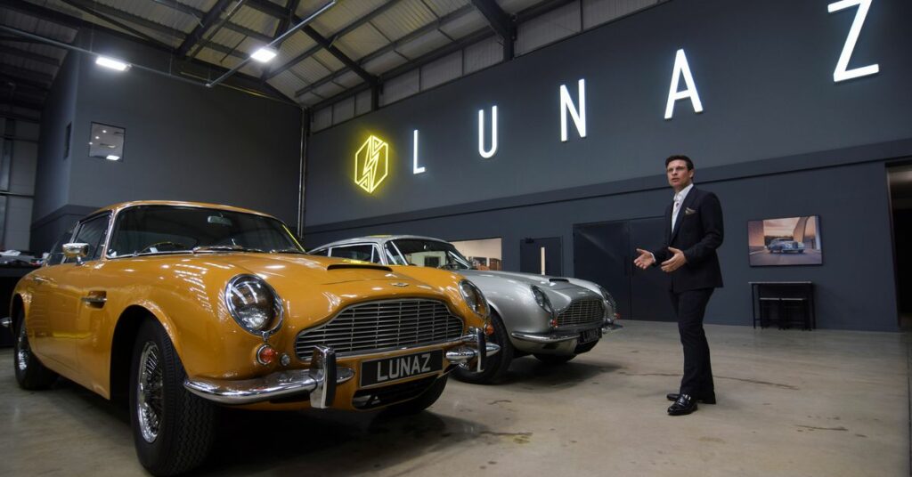 Vadim Shageleev, CEO of Charge Cars, which is building a replica of fully-electric Mustangs from the ground up, poses with a pre-production prototype of the Mustang, at the company’s headquarters in London, Britain, November 10, 2021. REUTERS/Nick Carey