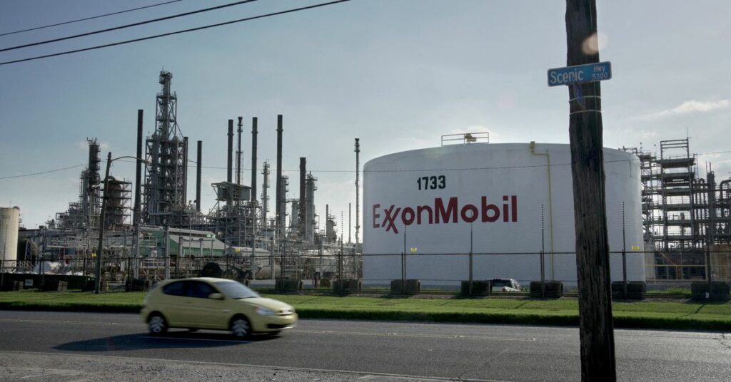 Signage is seen at an Exxon gas station in Brooklyn, New York City, U.S., November 23, 2021. REUTERS/Andrew Kelly/File Photo