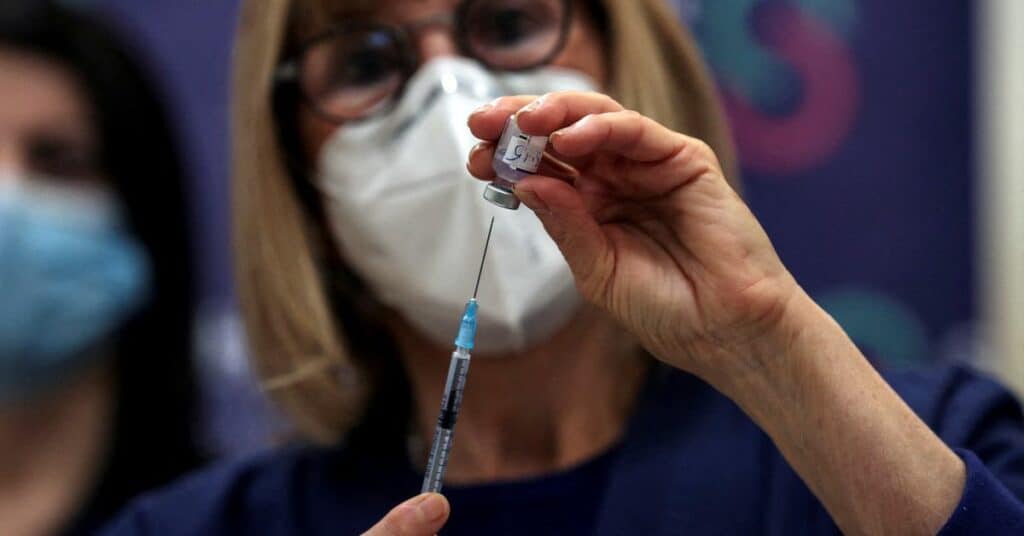 A nurse prepares a fourth dose of coronavirus disease (COVID-19) vaccine as part of a trial in Israel, at Sheba Medical Center in Ramat Gan, Israel December 27, 2021. REUTERS/Ronen Zvulun