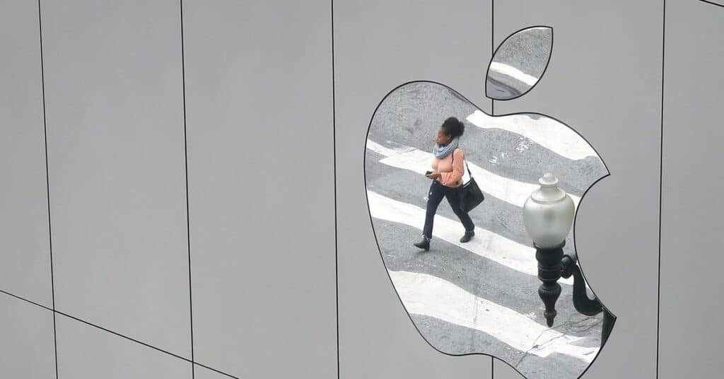 A woman is reflected in a Apple store logo in San Francisco, California, U.S., August 21, 2017. REUTERS/Kevin Coombs