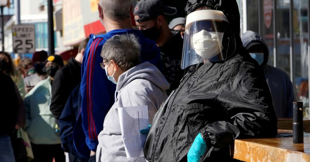 People wait in line to be tested for coronavirus disease (COVID-19) at the Tower Theatre in Oklahoma City, Oklahoma, U.S., January 11, 2022.  REUTERS/Nick Oxford