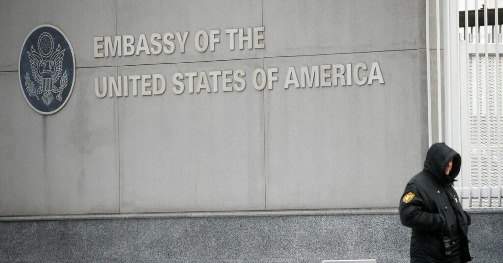 A security guard stands near the U.S. embassy in Kyiv, Ukraine February 12, 2022. REUTERS/Valentyn Ogirenko