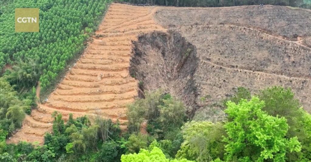 Rescuers work at the plane crash site in Wuzhou