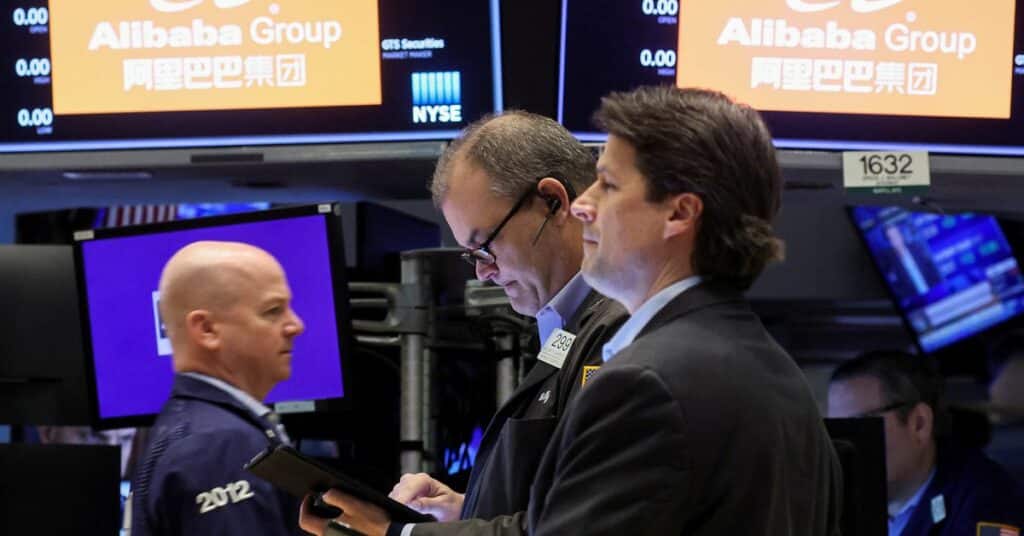 Traders work on the floor of the NYSE in New York