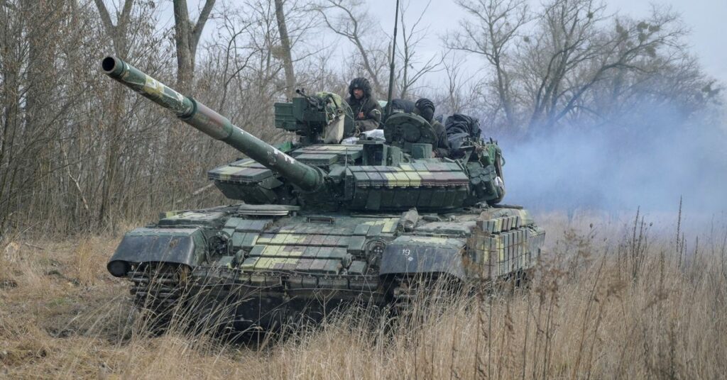 Service members of the Ukrainian armed forces are seen at their positions outside the settlement of Makariv near Zhytomyr