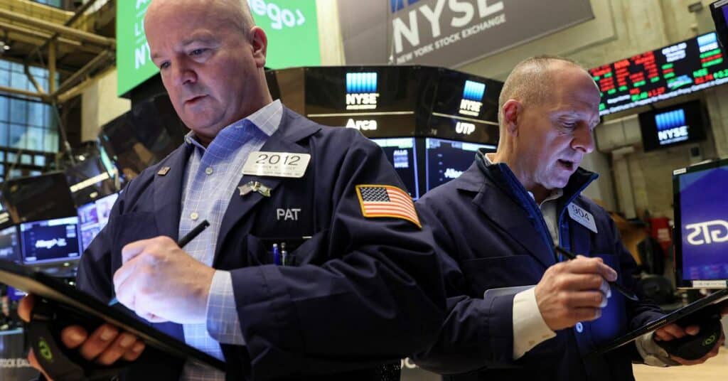 Traders work on the floor of the NYSE in New York