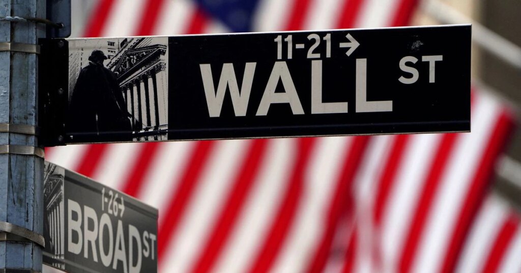 A Wall Street sign is pictured outside the New York Stock Exchange in New York