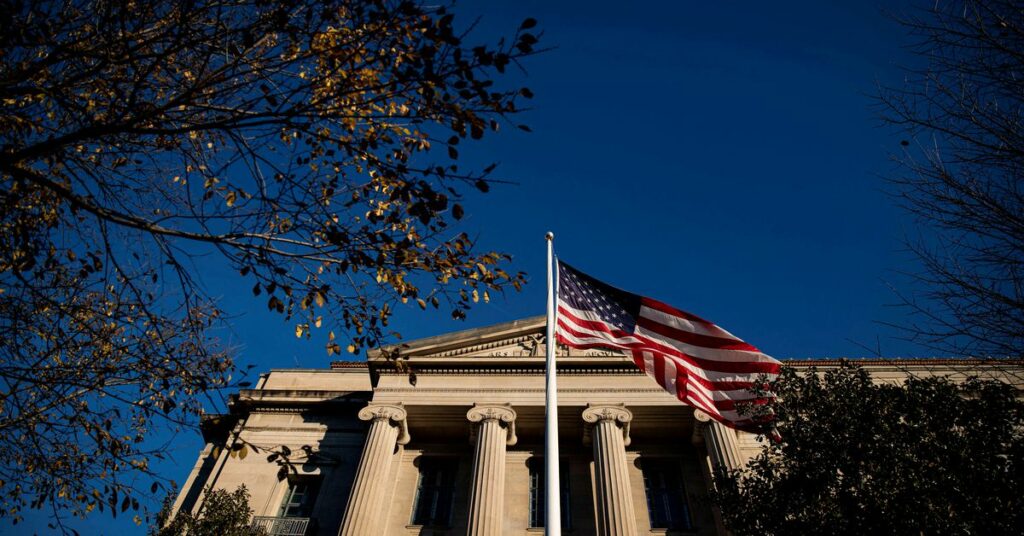 The Department of Justice logo is seen on the podium during a news conference on the Gozi Virus in New York