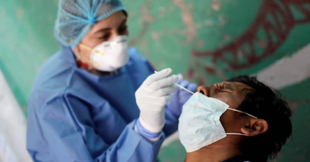 A man is given a coronavirus disease (COVID-19) test at pop-up testing site in New York