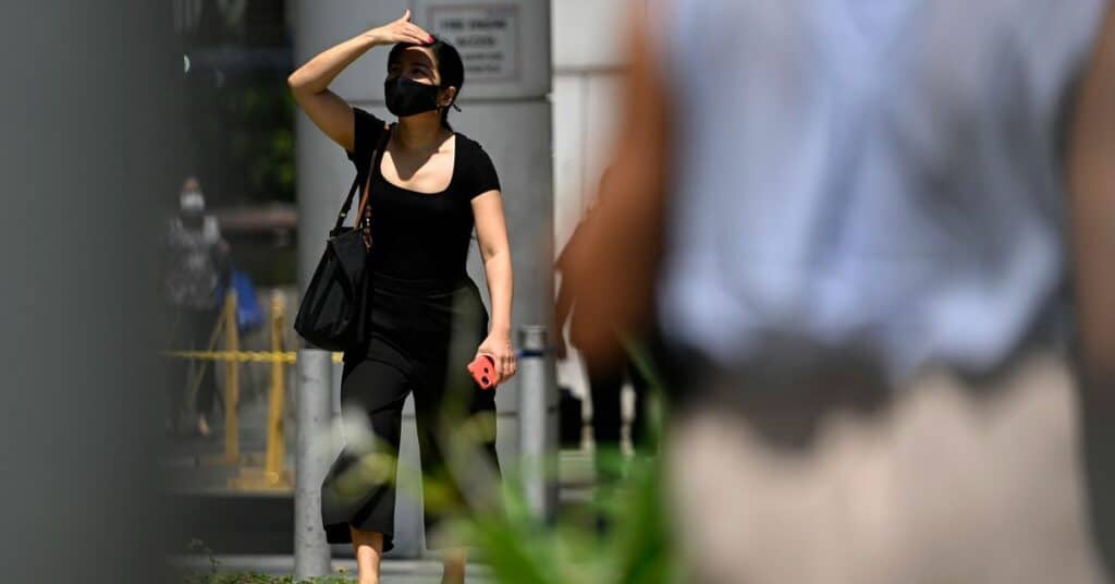 A lady strolls along the street amid the coronavirus disease (COVID-19) Omicron wave in Singapore