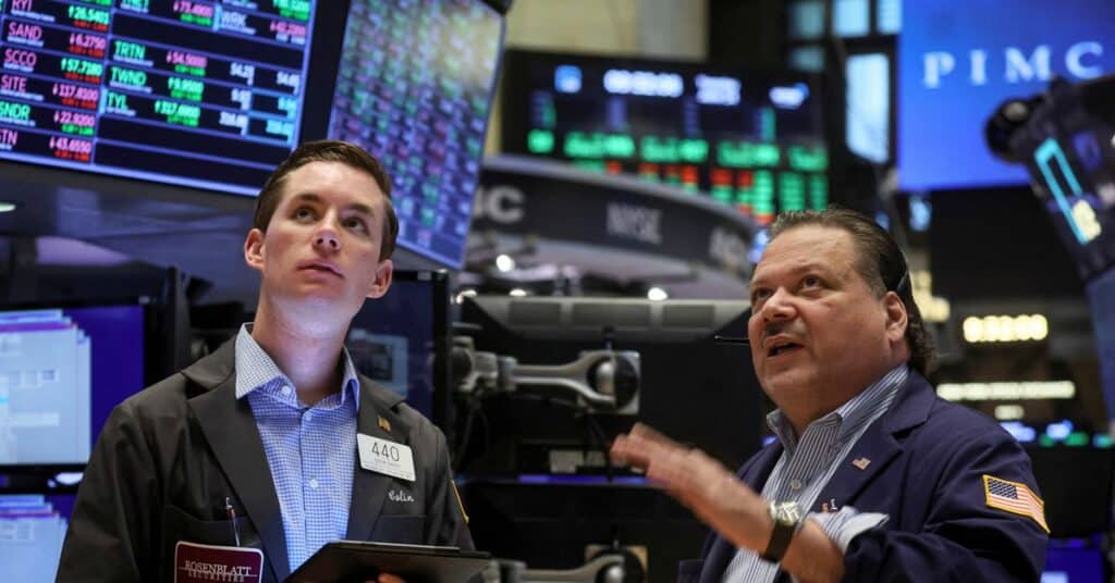 Traders work on the floor of the NYSE in New York