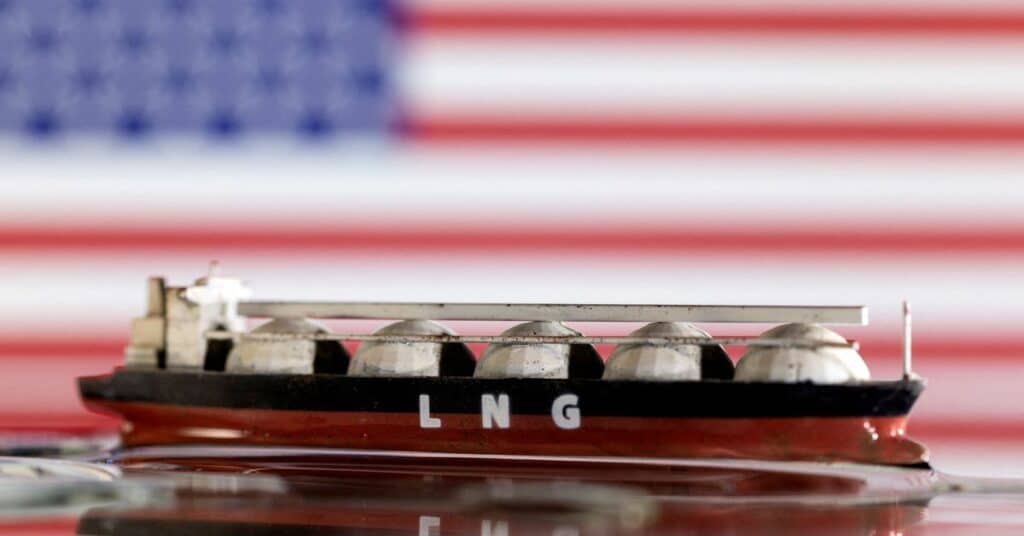 Illustration shows model of LNG tanker and the U.S. flag