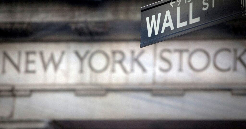 Traders work on the floor of the NYSE in New York