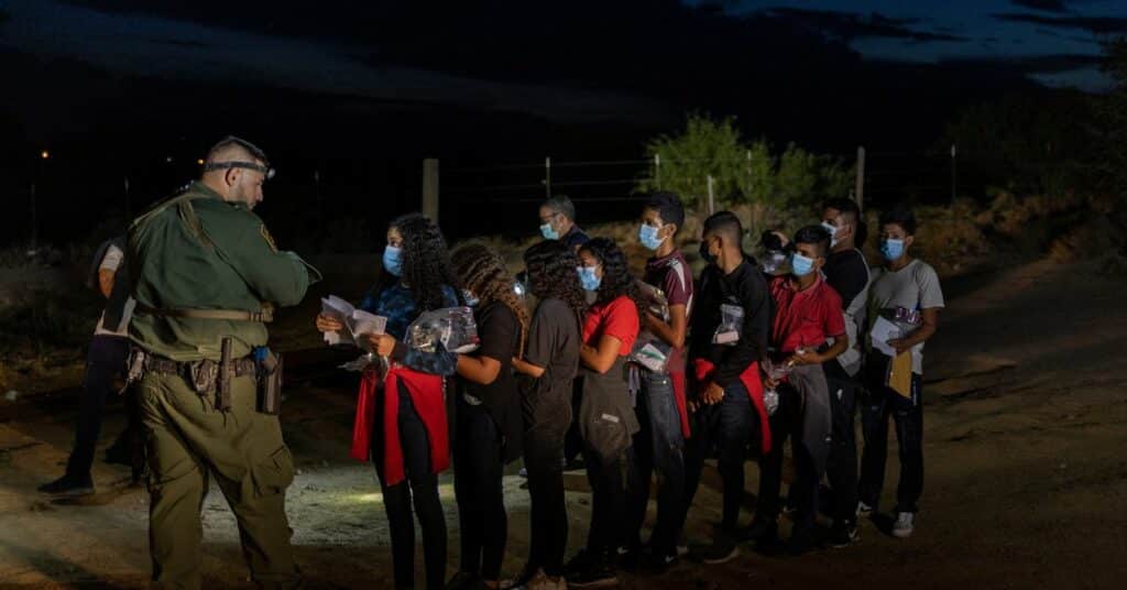 Asylum-seeking migrants cross the Rio Bravo river in Ciudad Juarez