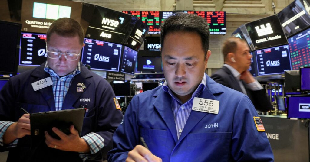 Raindrops hang on a sign for Wall Street outside the New York Stock Exchange in New York