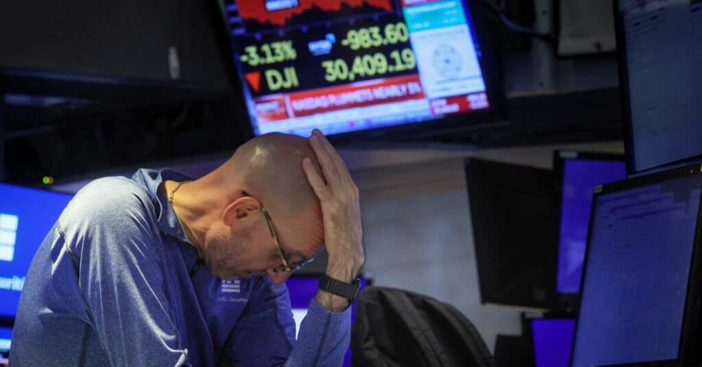 Traders work on the floor of the NYSE in New York