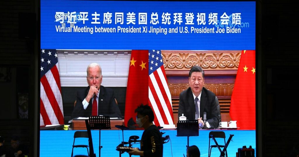 Screen shows Chinese President Xi Jinping attending a virtual meeting with U.S. President Joe Biden via video link, at a restaurant in Beijing