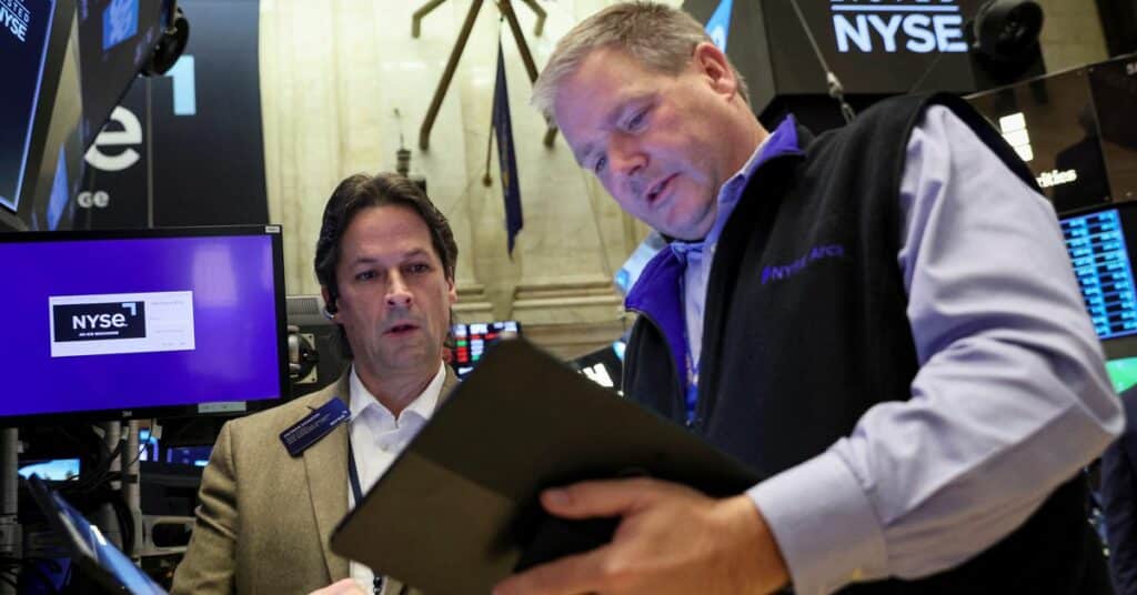 Traders work on the floor of the NYSE in New York City