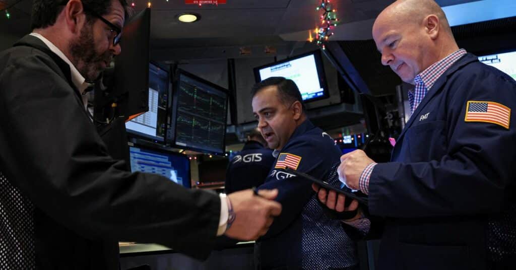 Traders work on the floor of the NYSE in New York