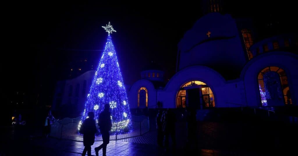 Christmas tree is seen in front of an Orthodox cathedral during a service on the eve of Christmas in Kyiv