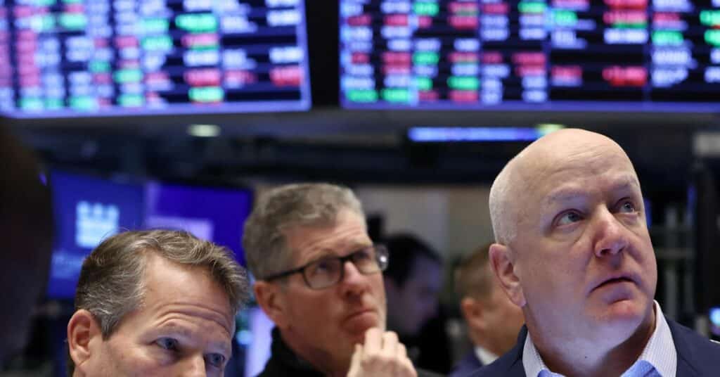 Traders work on the trading floor at the New York Stock Exchange (NYSE) in New York City