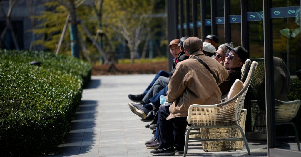 Elderly visitors enjoy the sunshine, at a nursing home of Lendlease