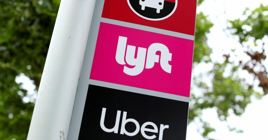 The logos of Lyft and Uber are displayed in San Diego