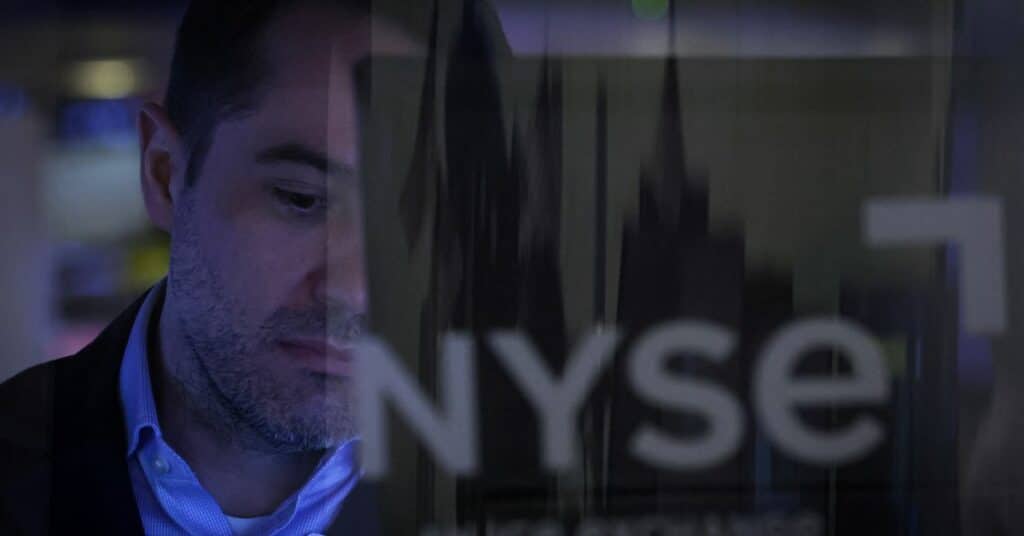 Traders work on the floor of the NYSE in New York