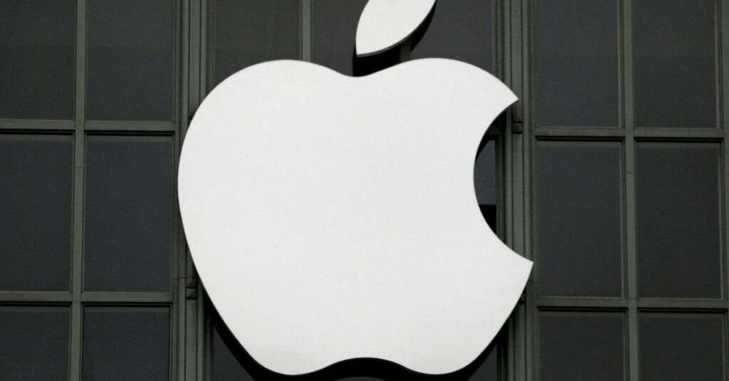 The Apple Inc logo is shown outside the company