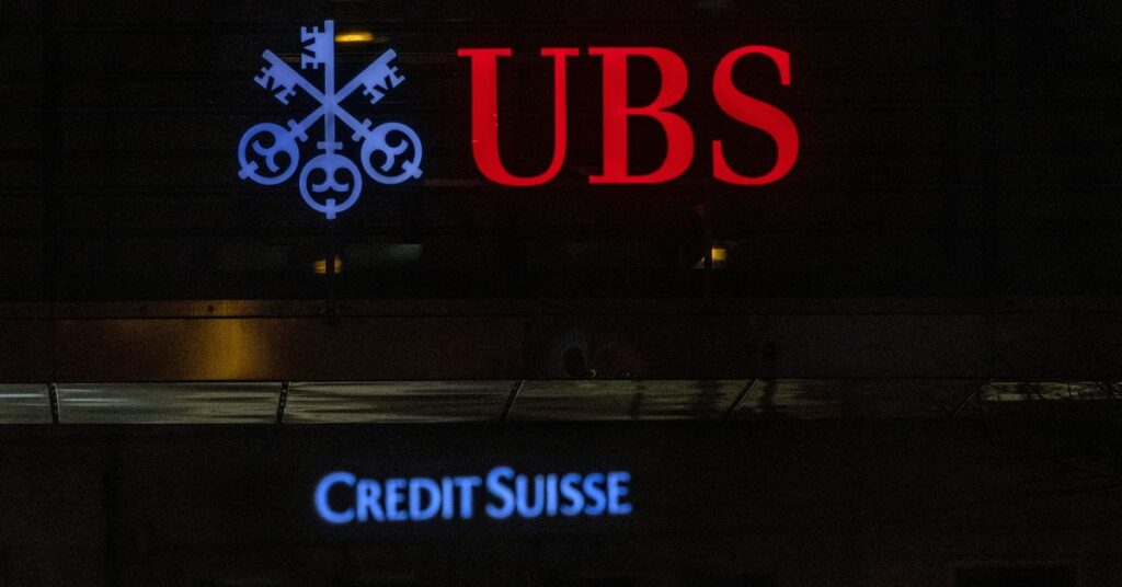 UBS and Credit Suisse banks logos are seen in Zurich