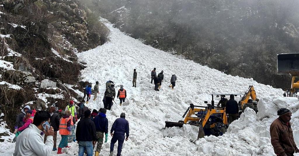 Rescue team members search for survivors after an avalanche in the northeastern state of Sikkim