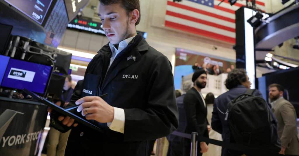 Traders work on the trading floor at the New York Stock Exchange (NYSE) in New York City