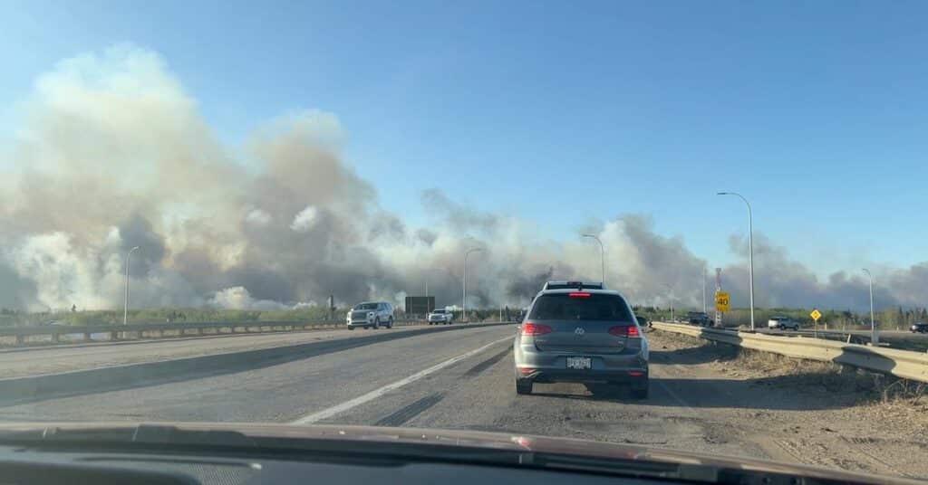 Smoke rises from a wildfire in Strathcona County, Alberta