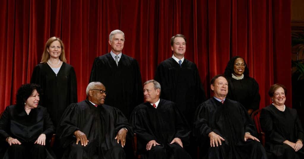 U.S. Supreme Court justices pose for their group portrait at the Supreme Court in Washington