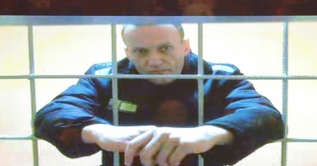 Jailed Russian opposition leader Alexei Navalny is seen on a screen during a court hearing in Moscow