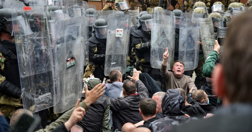 NATO Kosovo Force (KFOR) soldiers clash with local Kosovo Serb protesters in the town of Zvecan