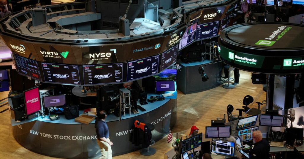 Traders work on the floor of the NYSE in New York