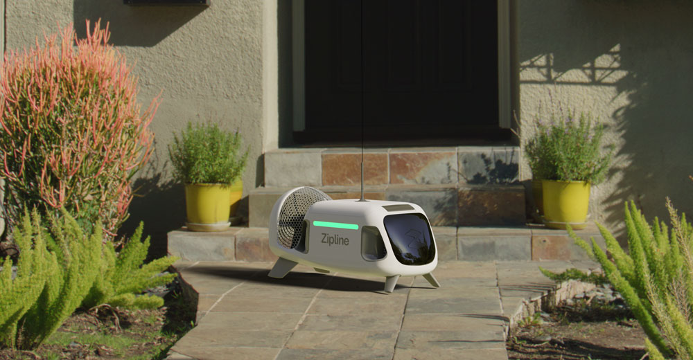 Zipline drone making a package delivery to the front door of a home